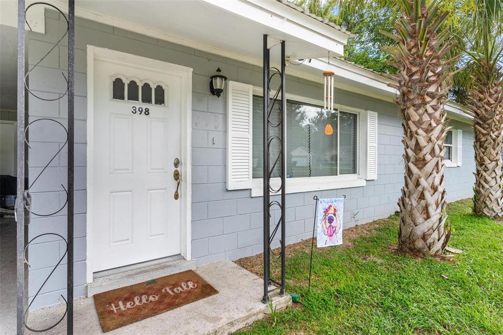 398 Rose Street Umatilla, FL 32784 - Photo 2 of 30 a front view of a house with a yard