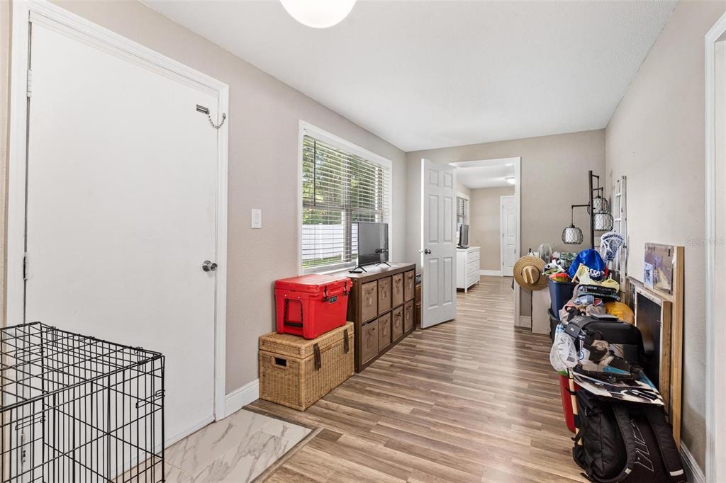 398 Rose Street Umatilla, FL 32784 - Photo 21 of 30 a view of a room with lots of stuff and hardwood floor
