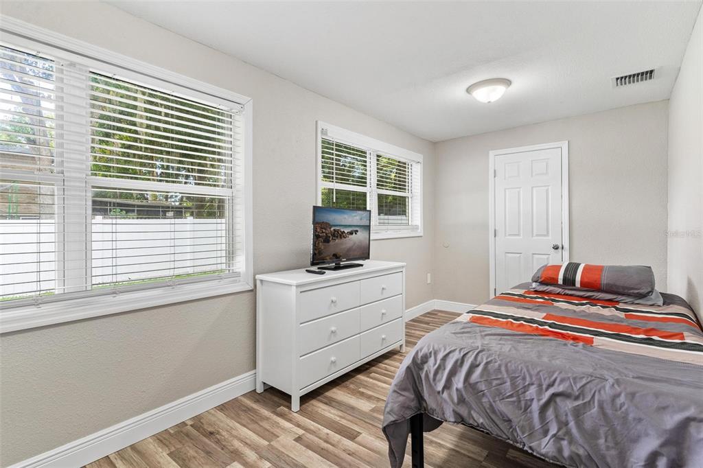 398 Rose Street Umatilla, FL 32784 - Photo 22 of 30 a bedroom with a bed and a window