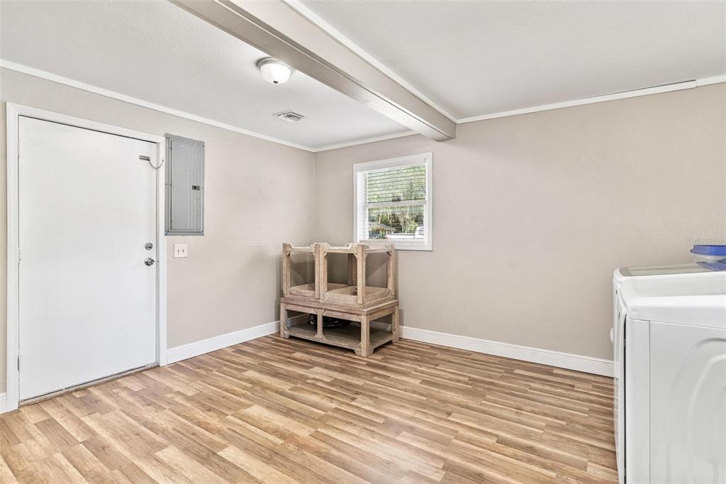 398 Rose Street Umatilla, FL 32784 - Photo 24 of 30 a room with a bed and a window