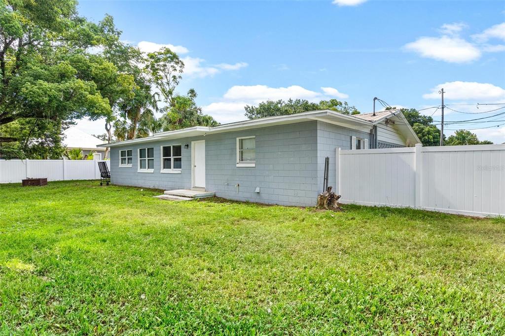 398 Rose Street Umatilla, FL 32784 - Photo 26 of 30 a view of a house with a backyard