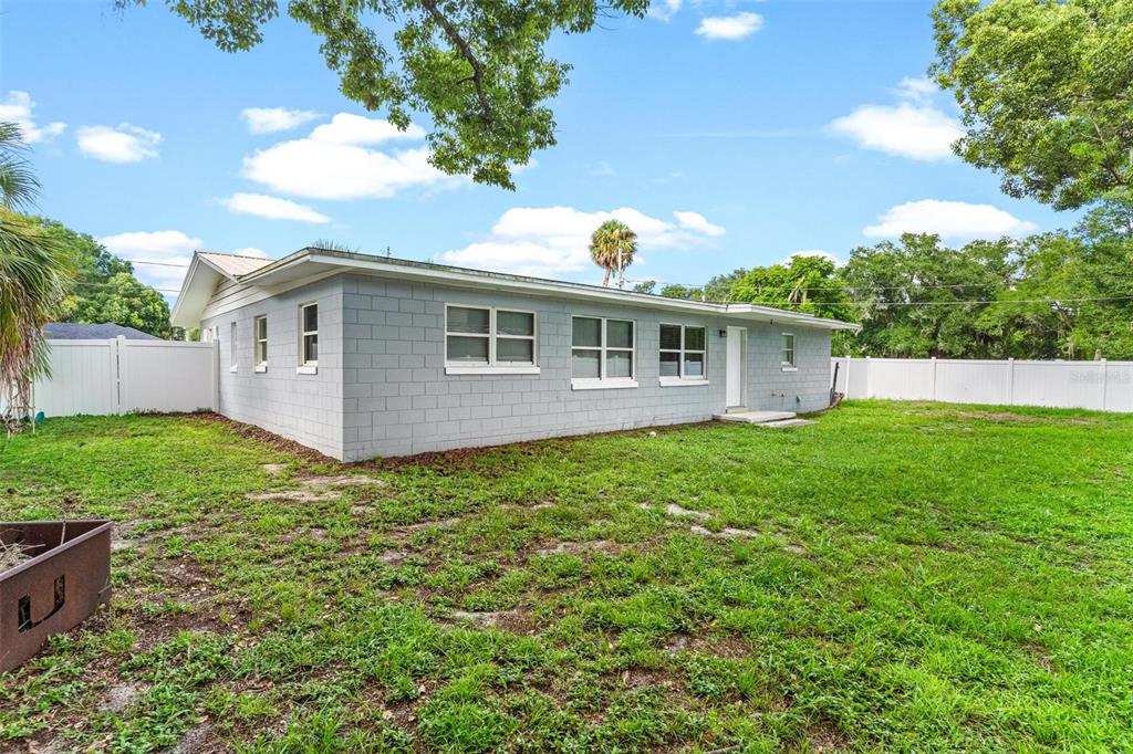 398 Rose Street Umatilla, FL 32784 - Photo 27 of 30 a view of a house with a backyard