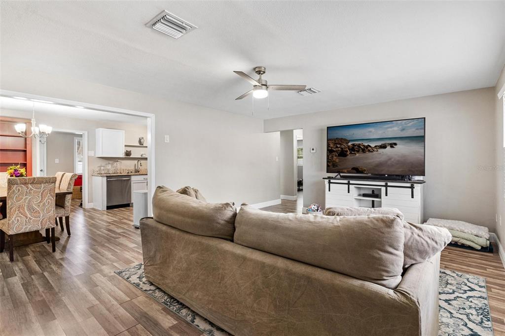 398 Rose Street Umatilla, FL 32784 - Photo 4 of 30 a living room with furniture and a flat screen tv
