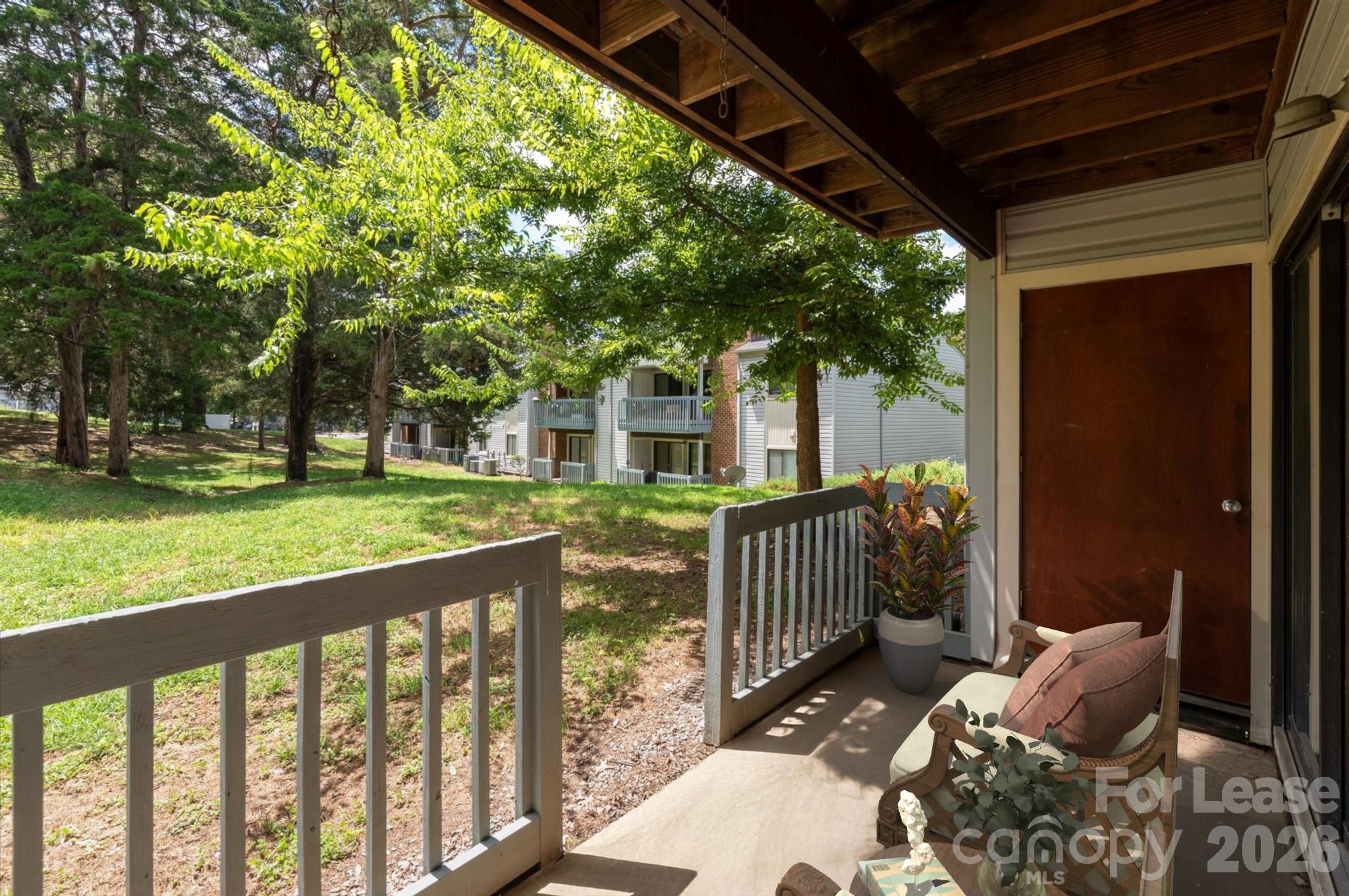 11084 Harrowfield Road Charlotte, NC 28226 - Photo 29 of 31 a view of a bench in the deck front of house