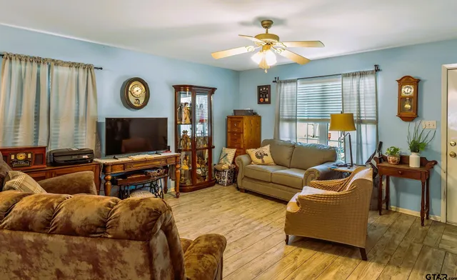 a living room with furniture and a flat screen tv
