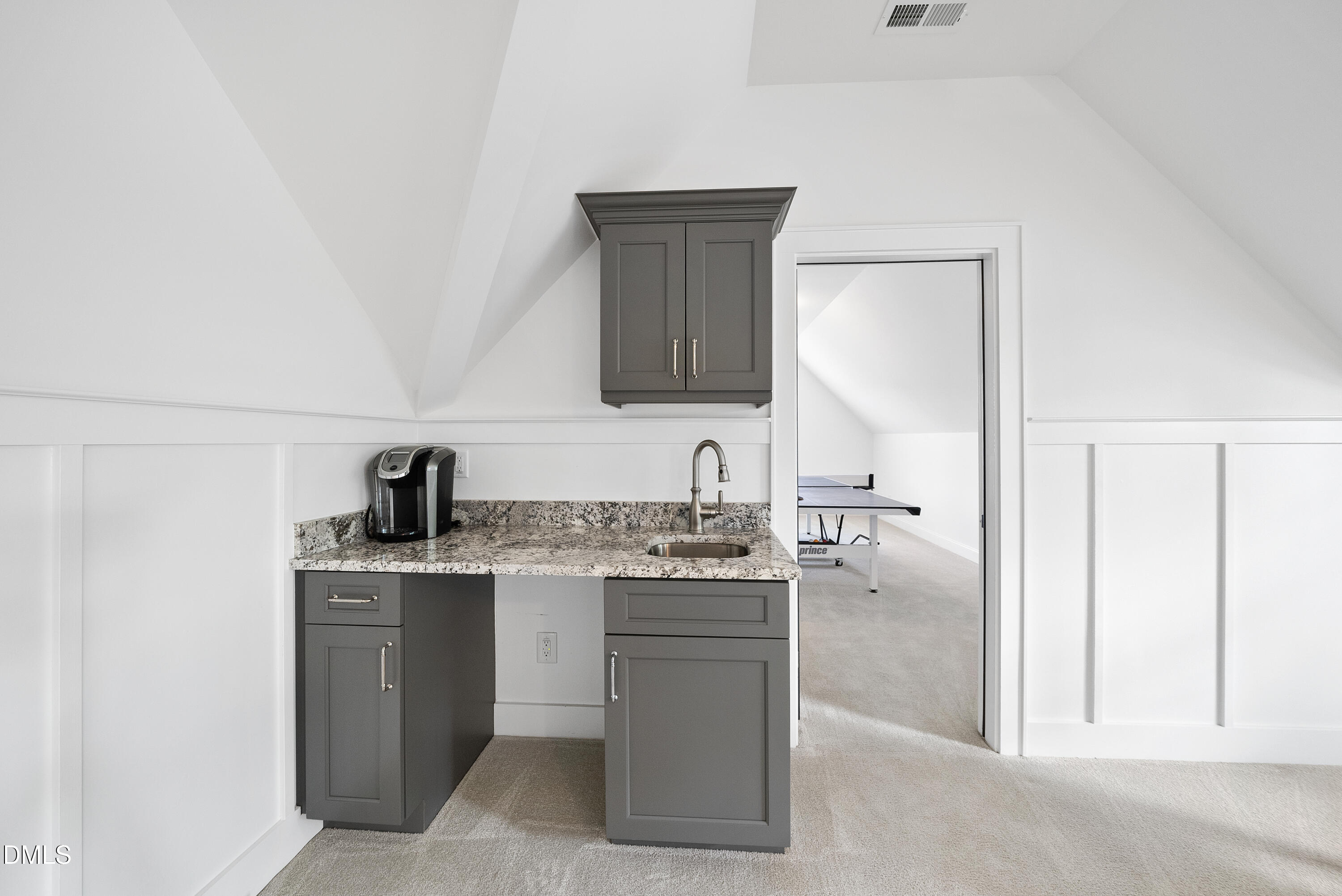 5109 Wainscott Way Raleigh, NC 27612 - Photo 34 of 52 a kitchen with a sink and cabinets