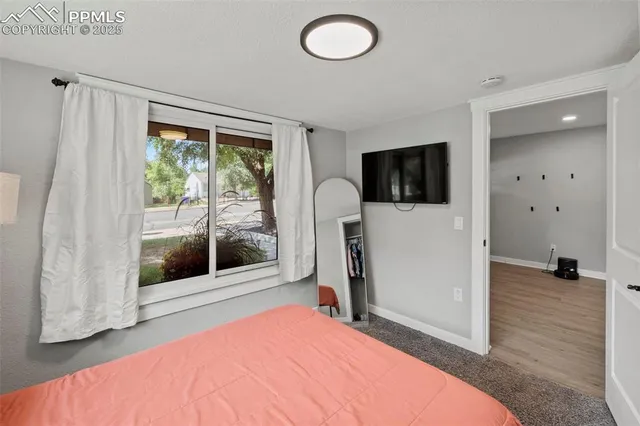 a view of a livingroom with furniture and front door