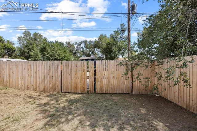 a view of a backyard of the house