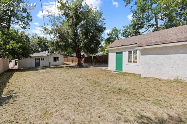 a house with trees in front of it
