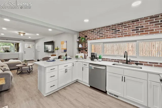 a kitchen with sink and cabinets