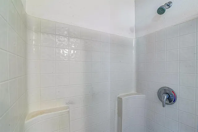 a living room with furniture flat screen tv and wooden floor