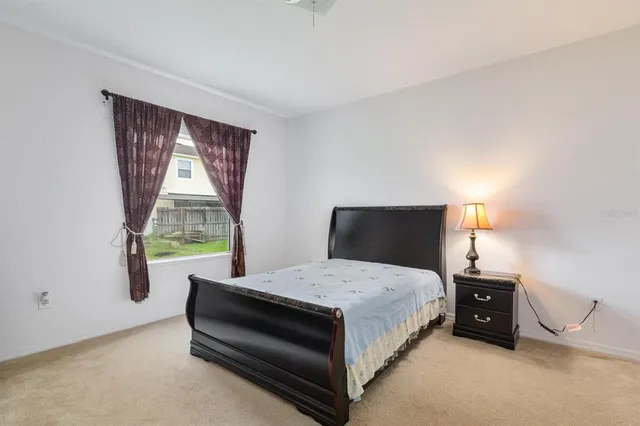 a bathroom with a granite countertop sink a toilet and a mirror