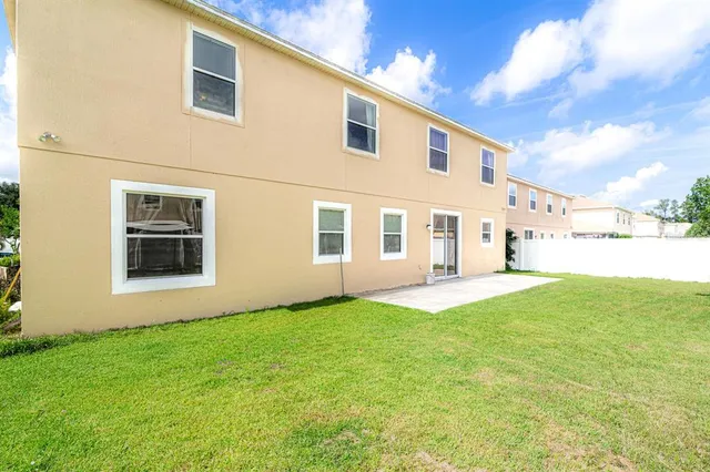 a aerial view of a house with a garden and plants