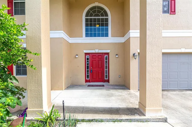 a view of a dining room with furniture wooden floor and chandelier