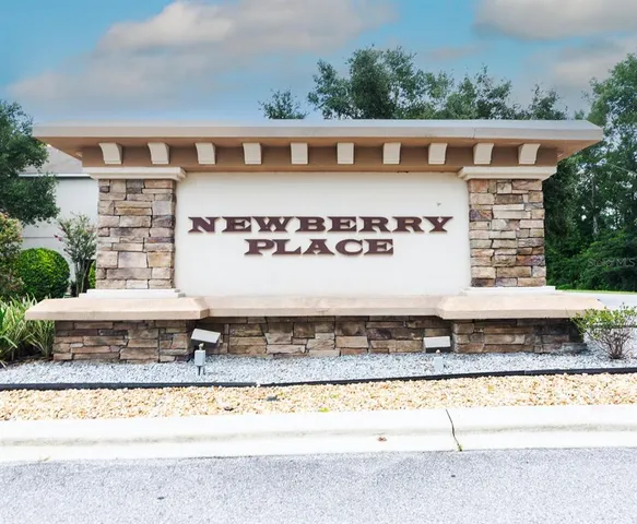 an aerial view of a house with a garden and plants
