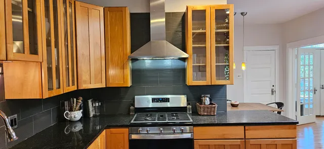 a view of balcony with two chairs and a table