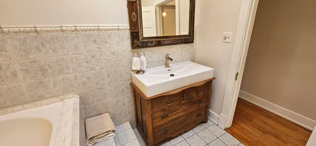 a view of a wooden fence and a forest