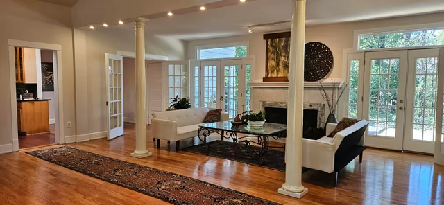 a living room with furniture and a fireplace