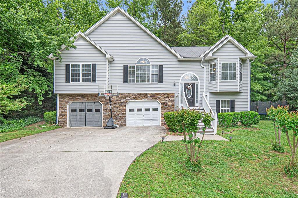 203 Gilberts Way Temple, GA 30179 - Photo 1 of 1 a front view of a house with yard and green space