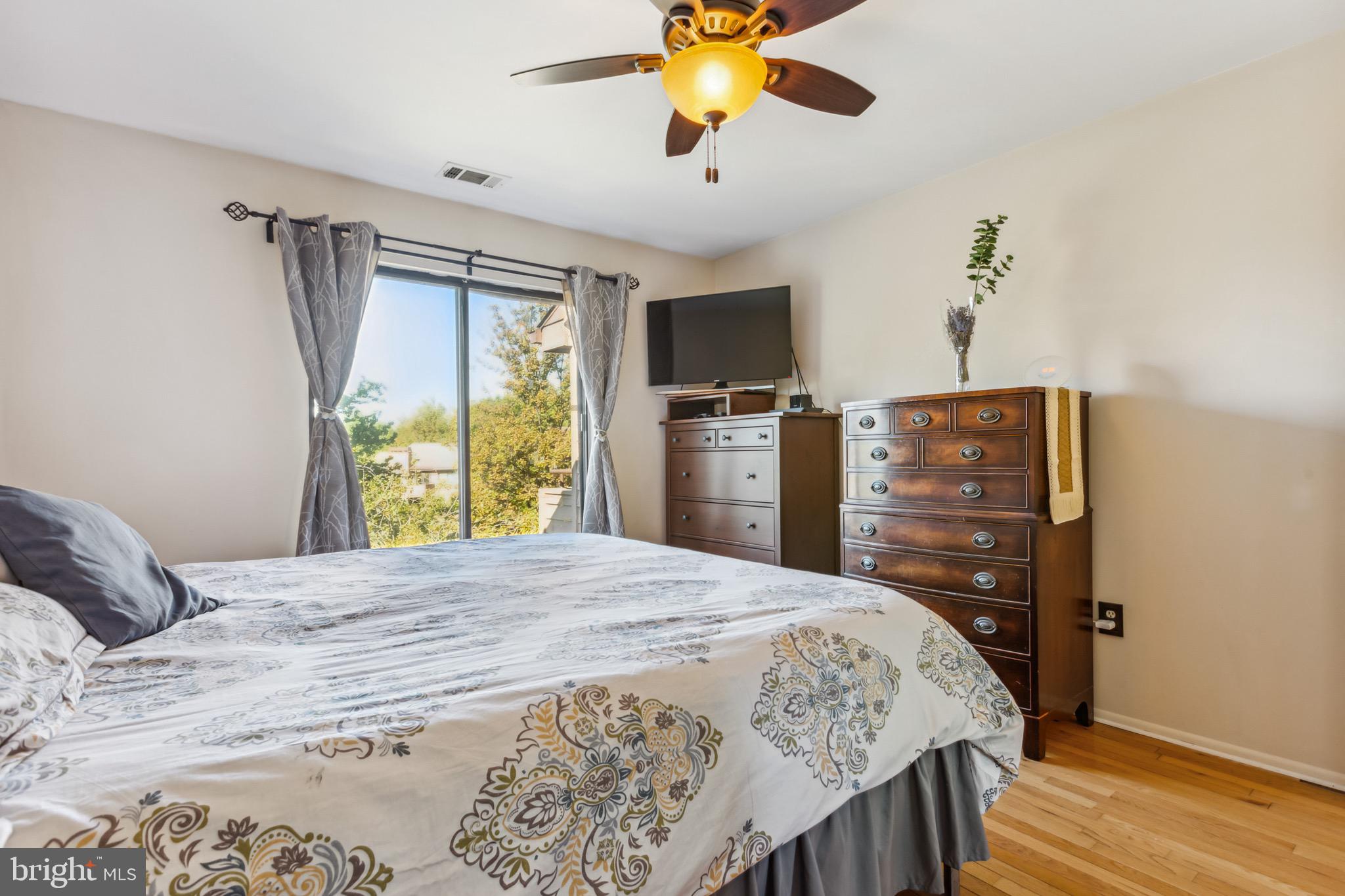 5355 Smooth Meadow Way, Unit 5 Columbia, MD 21044 - Photo 19 of 30 Primary Bedroom w/ Hardwood Floors