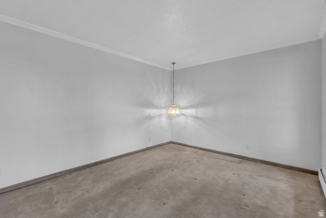 10705 Green Ridge Drive Sandy, UT 84070 - Photo 19 of 55 Carpeted spare room with ornamental molding and baseboards