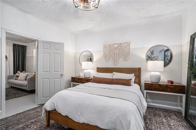 a bedroom with a bed and a table