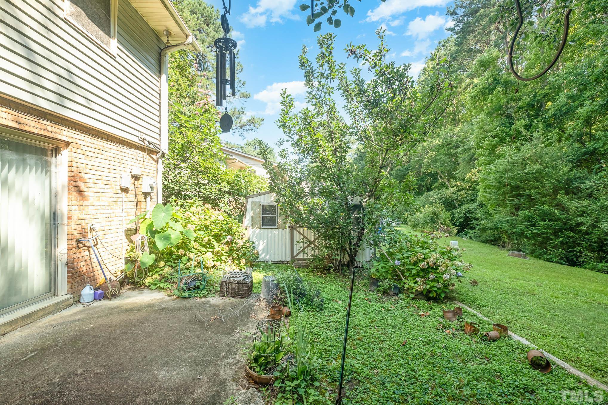 2409 Foxtrot Road Raleigh, NC 27610 - Photo 14 of 14 a plant that is in front of a house
