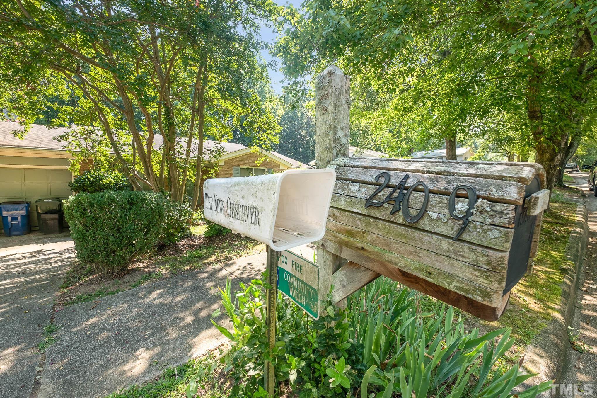 2409 Foxtrot Road Raleigh, NC 27610 - Photo 4 of 14 a view of a bench in the backyard