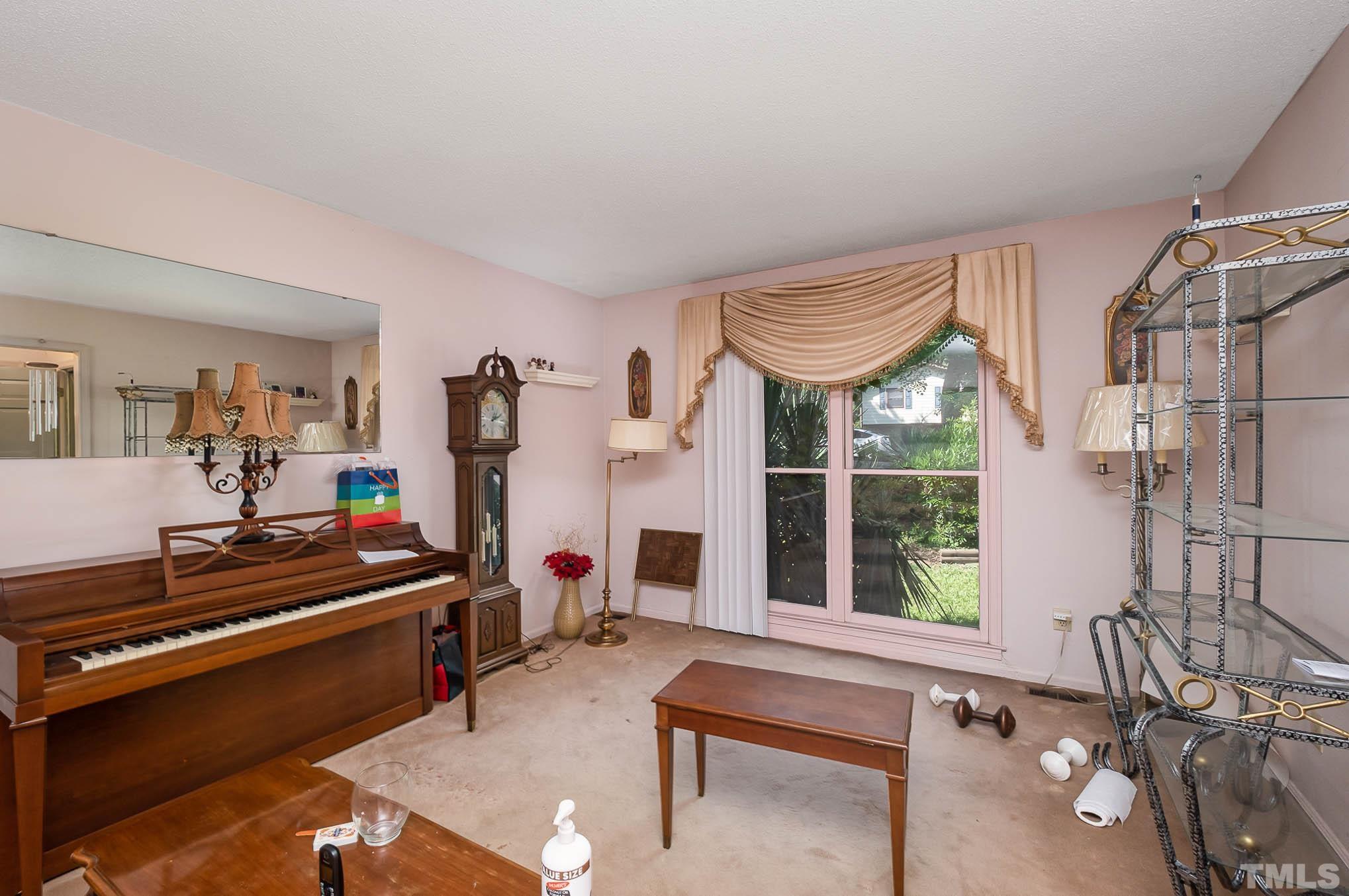 2409 Foxtrot Road Raleigh, NC 27610 - Photo 7 of 14 a room with gym equipment and a window