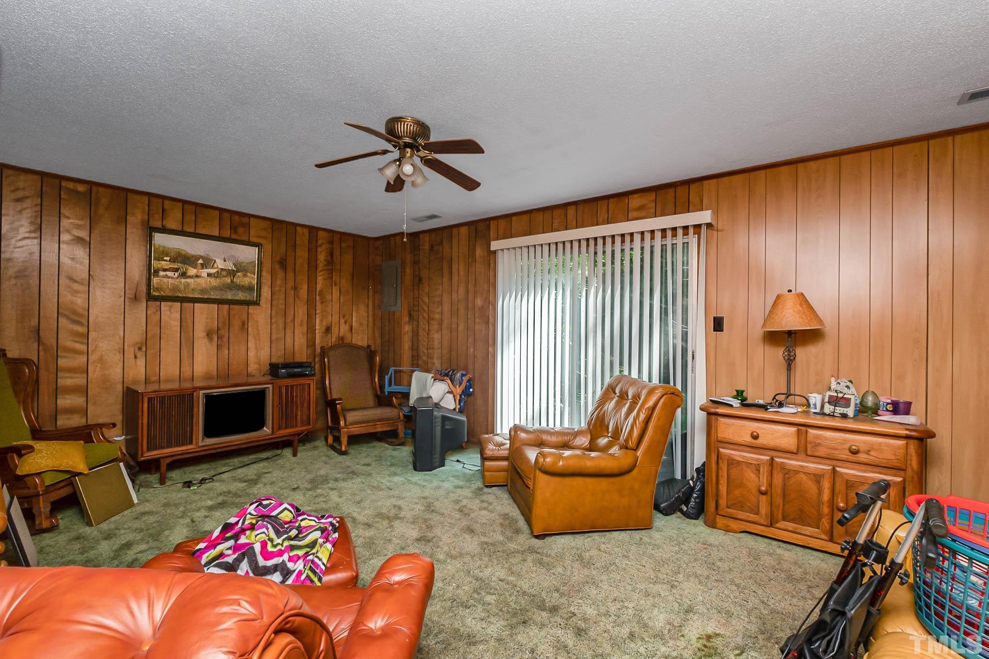 2409 Foxtrot Road Raleigh, NC 27610 - Photo 8 of 14 a living room with furniture a rug and a window