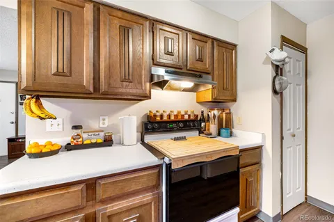 a kitchen with a sink cabinets and utility room
