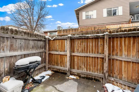 a view of a balcony with furniture