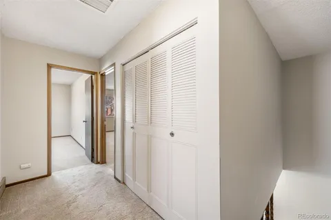 a view of hallway with closet