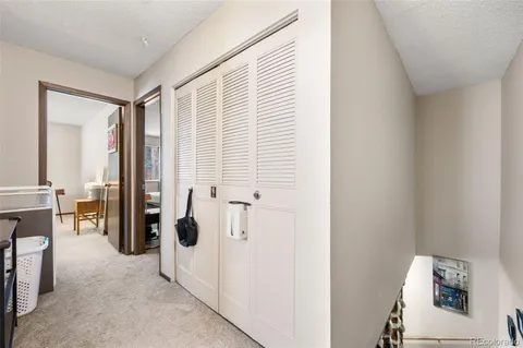 a view of livingroom with furniture and refrigerator