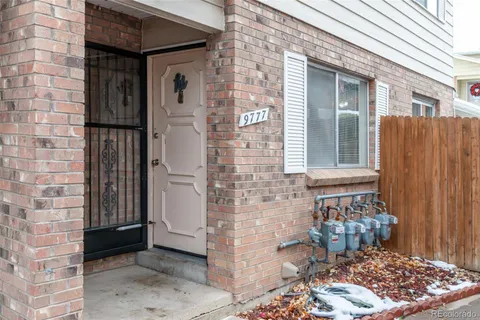 a view of a wooden door of the house