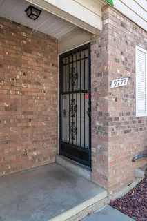 a view of a wooden door of the house