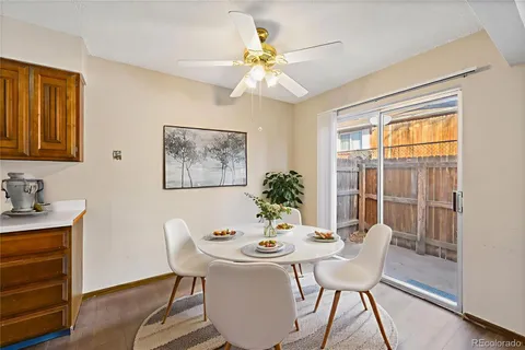 a dining room with furniture and window