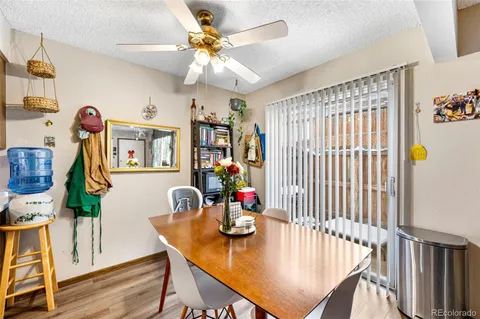 a view of a dining room with furniture and chandelier