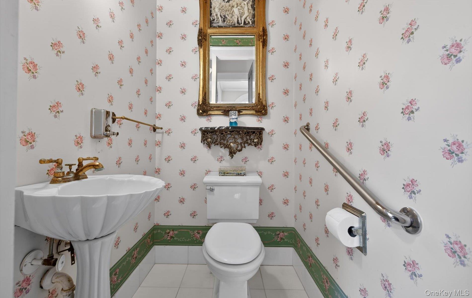 38 Tiffany Road Oyster Bay, NY 11771 - Photo 15 of 50 Bathroom featuring tile patterned flooring and wallpapered walls, Ceramic pedestal sink