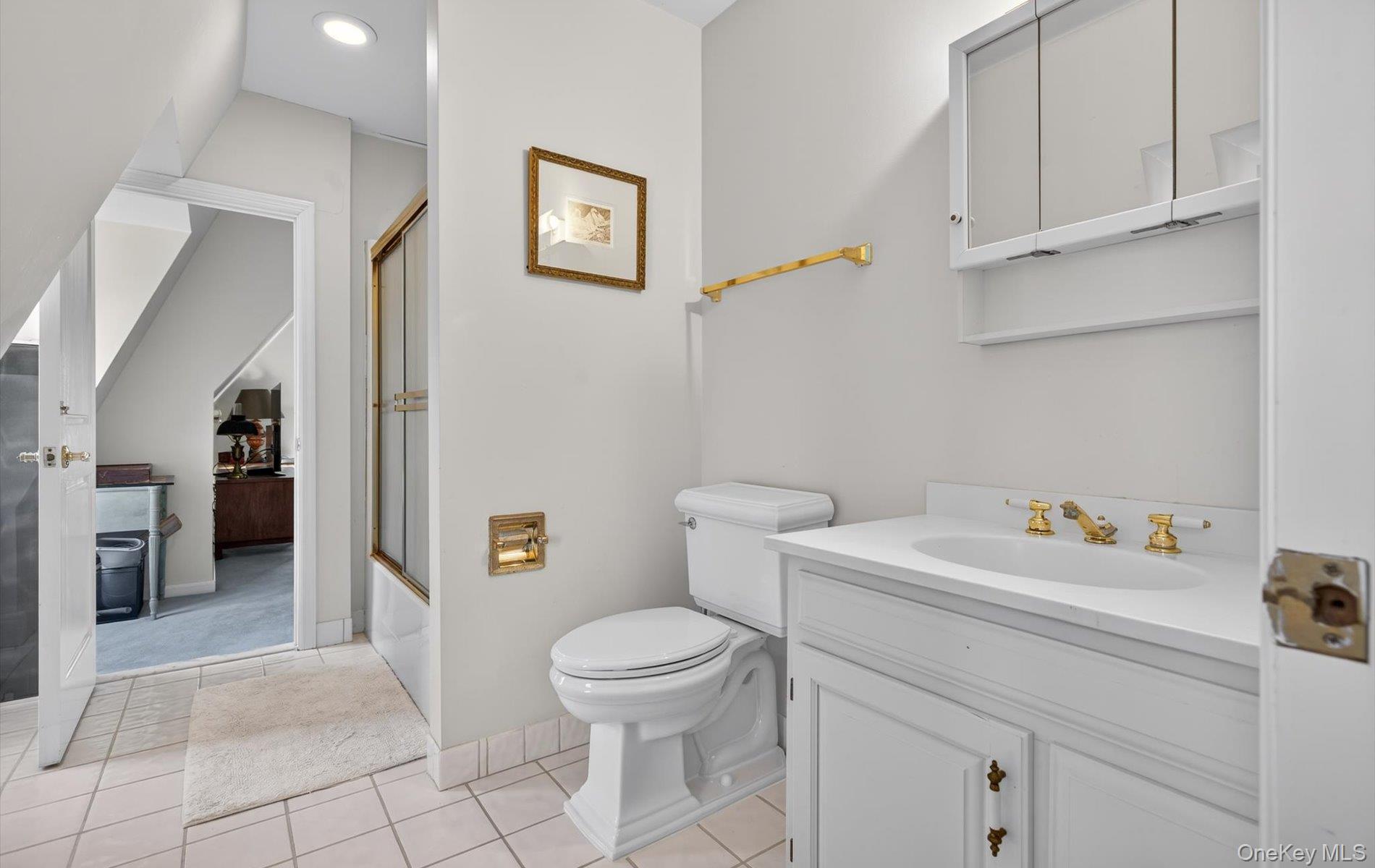 38 Tiffany Road Oyster Bay, NY 11771 - Photo 34 of 50 Jack and Jill Bathroom featuring enclosed tub / shower combo, vanity, light tile patterned floors, and recessed lighting