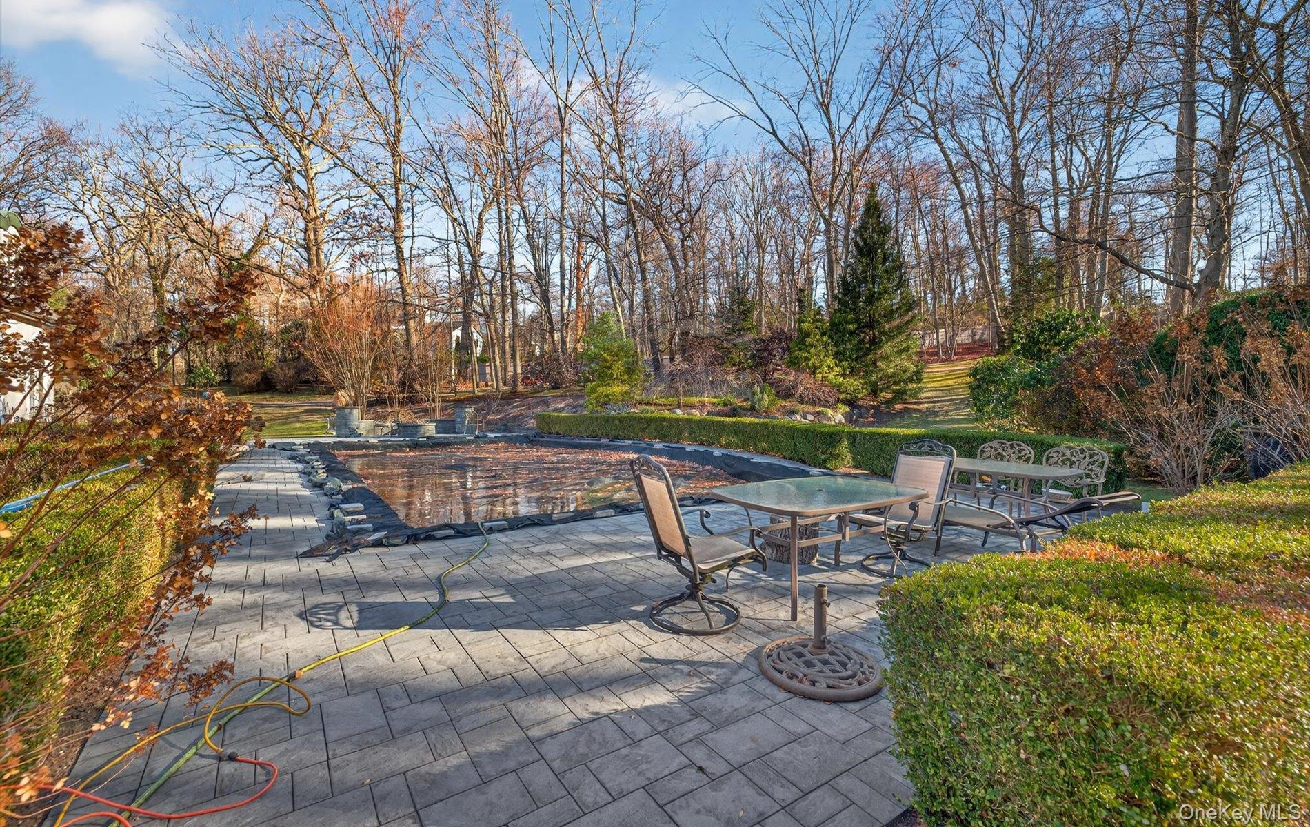 38 Tiffany Road Oyster Bay, NY 11771 - Photo 38 of 50 View of custom tumbled stone patio, gunite pool with fountain