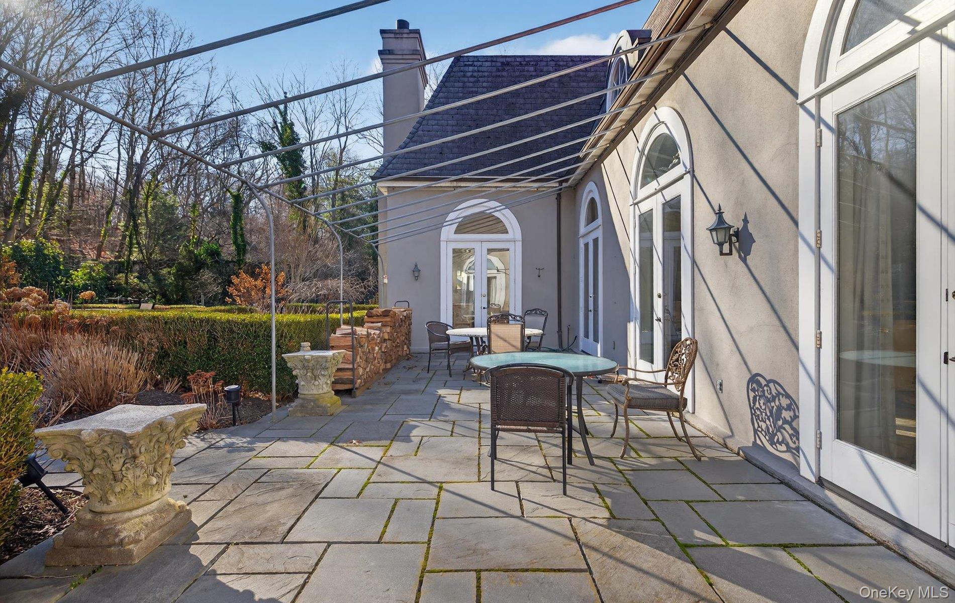 38 Tiffany Road Oyster Bay, NY 11771 - Photo 43 of 50 View of patio / terrace featuring french doors and outdoor dining area
