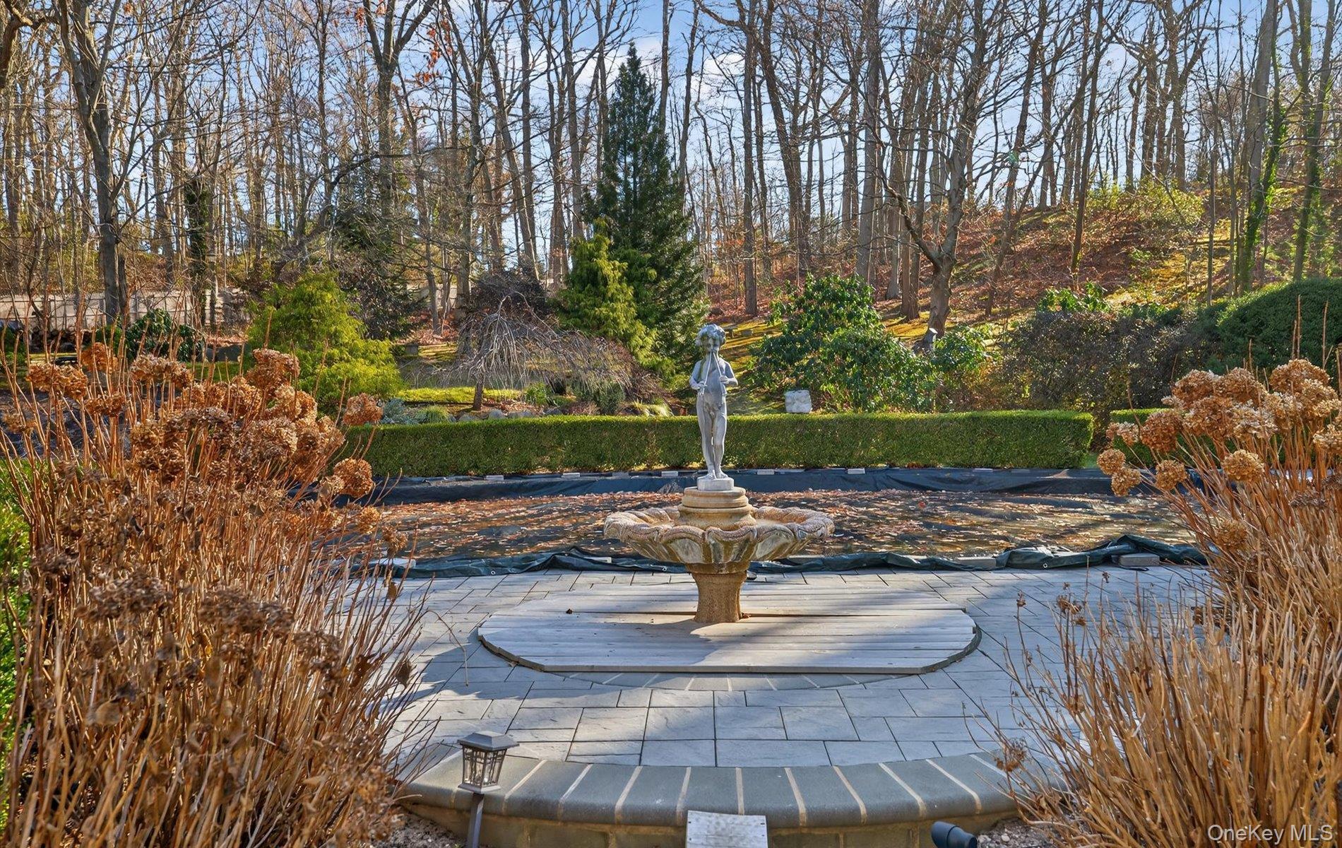 38 Tiffany Road Oyster Bay, NY 11771 - Photo 45 of 50 Fountain / featuring a patio and gunite pool