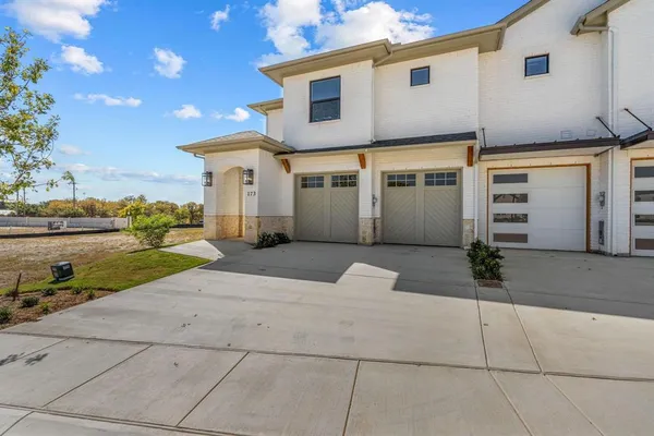 a house view with a garden space