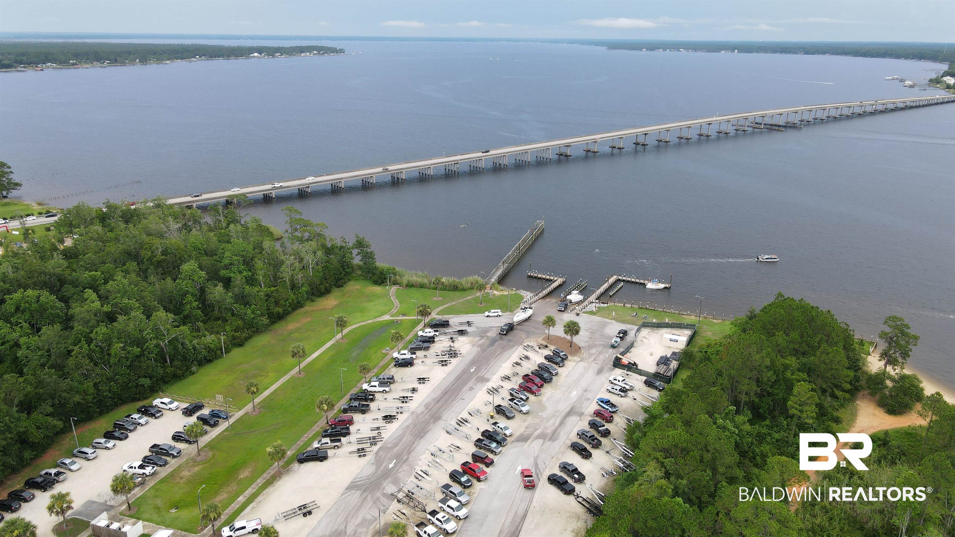 10257 Lyttleton Loop Lillian, AL 36549 - Photo 28 of 31 Aerial view of property and surrounding area with a notable bridge and a nearby body of water