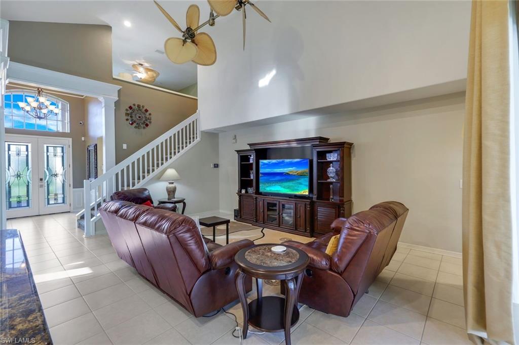 17896 Modena Road Miromar Lakes, FL 33913 - Photo 11 of 38 furnished Living room with a towering ceiling, Custom french entry doors.