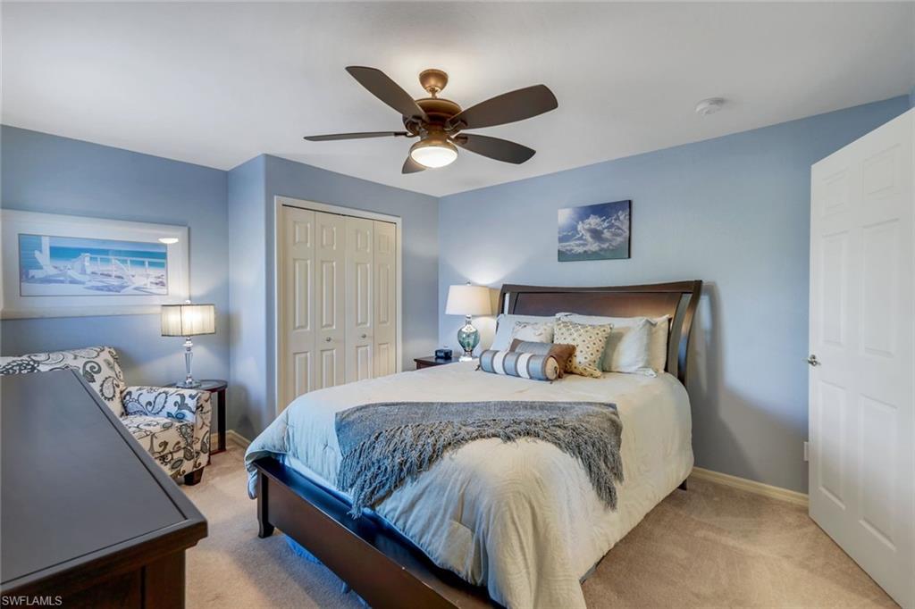 17896 Modena Road Miromar Lakes, FL 33913 - Photo 17 of 38 Bedroom #3 with private ensuite bath, a closet and ceiling fan/light.