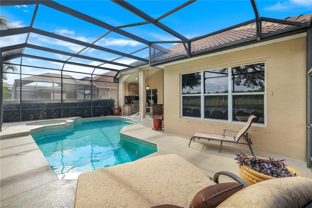 17896 Modena Road Miromar Lakes, FL 33913 - Photo 29 of 38 View of pool featuring an in ground hot tub, a lanai, and a patio