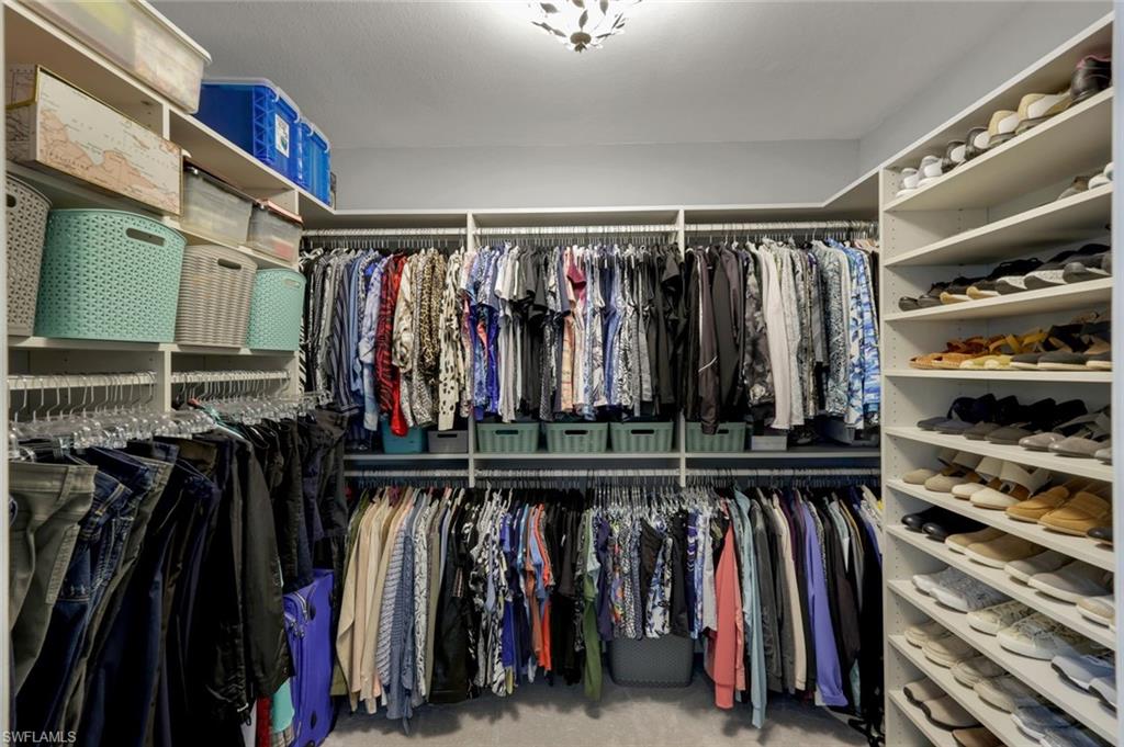 17896 Modena Road Miromar Lakes, FL 33913 - Photo 7 of 38 Spacious customized walk-in closet in Master Suite.
