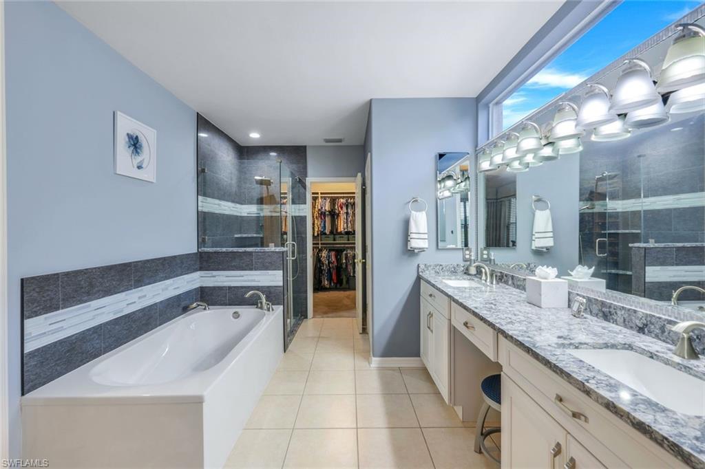 17896 Modena Road Miromar Lakes, FL 33913 - Photo 9 of 38 Updated master Bathroom featuring vanity, and separate shower and soaker tub